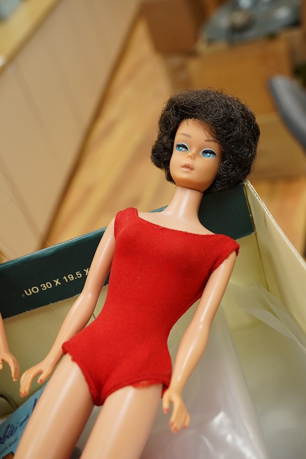 A 1960's Mattel Inc. Barbie doll, 1963, together with a Skipper doll, and a collection of eight original outfits with accessories, sorted into individual packets, outfits purchased between 1963 to 1966 include; American